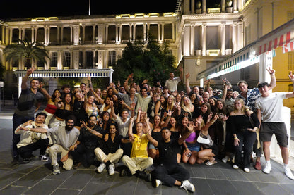 Young international crowd enjoying a fun pub crawl in Nice with Beer&Dash nightlife experience.